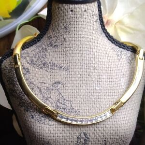 Necklace with 11 princess cut Rhinestones, Gold tone.
